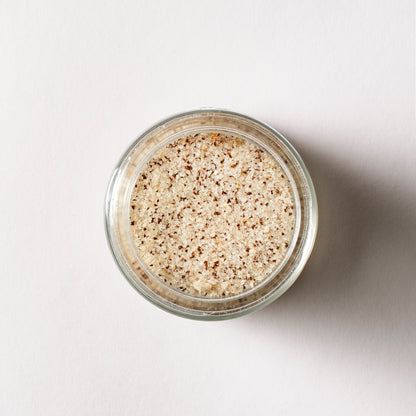 a jar of brown and white salt